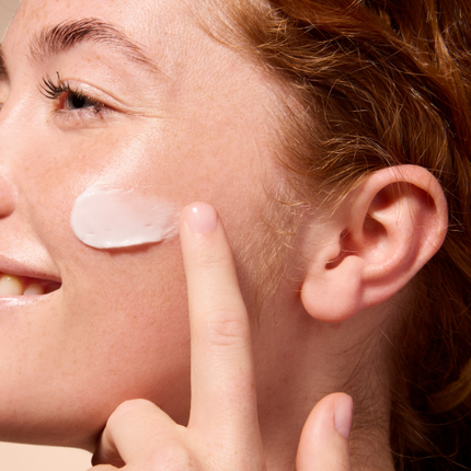 Woman model with cleanser on face