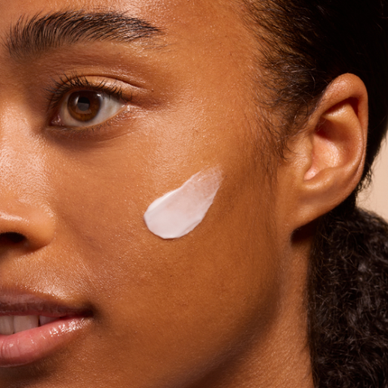 Woman model with cream on face